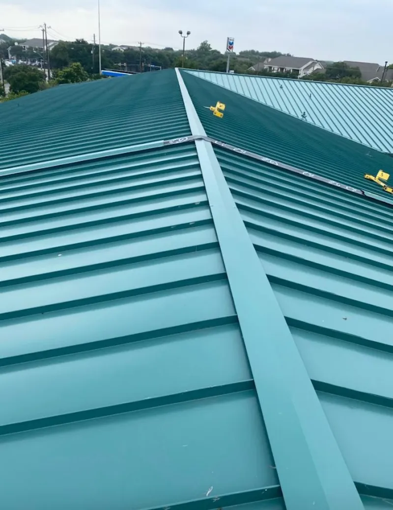 Green commercial metal roof ridge and valley for Metal Roof Repair in Navarre